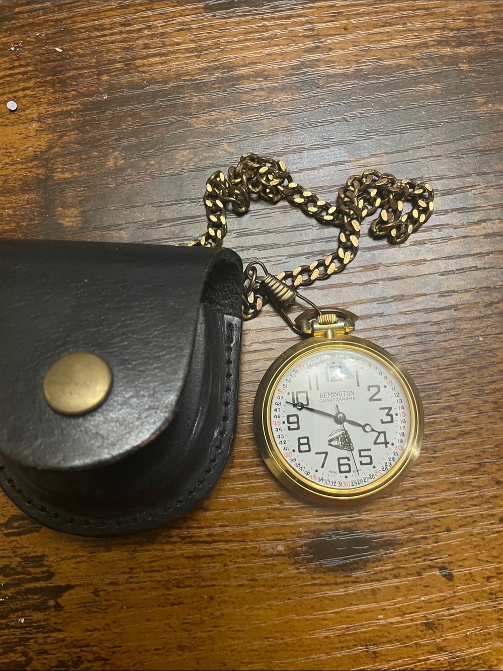 Remington Gold Pocket Watch with Black Leather Pouch and Gold Chain 1950-1959